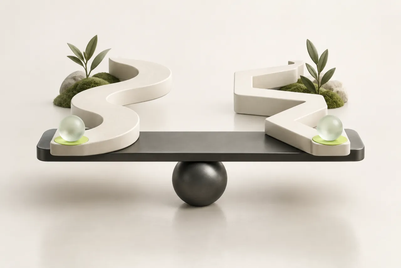 Two differently shaped ceramic pathways rest on a balanced graphite comparison frame.