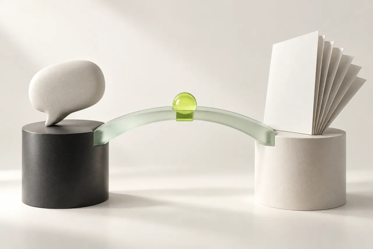 A glass bridge connects an empty ceramic speech bubble with a fan of blank editorial pages.